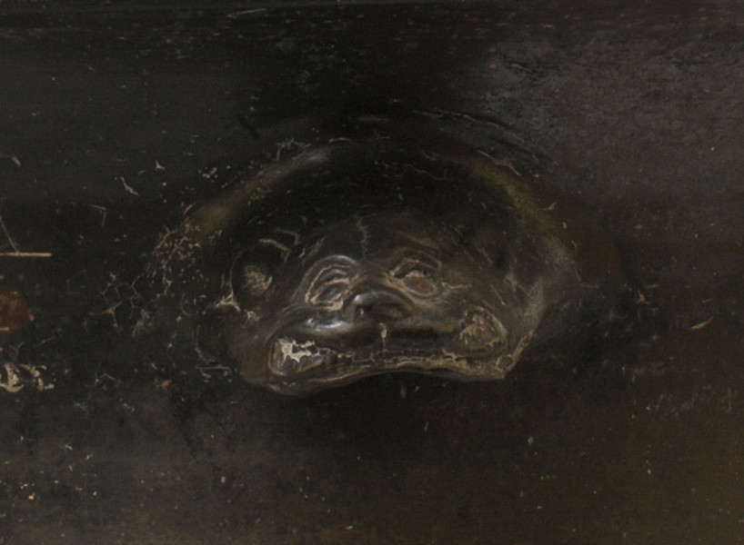 strona druga - fragment z uchwytem wymodelowanym na kształt lwiej głowy