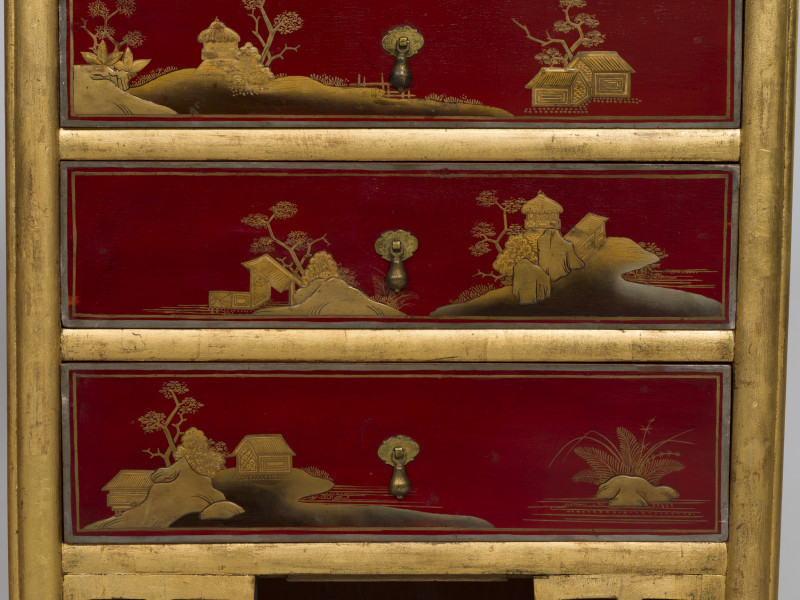 zbliżenie na dekorację szuflad - chińskie pejzaże z pawilonami i domami