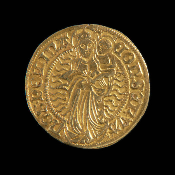 Gulden - Ujęcie rewersu. Na rewersie Madonna z Dzieciątkiem na lewym ramieniu stojąca na półksiężycu. Wokół promienie. W perełkowym otoku napis.