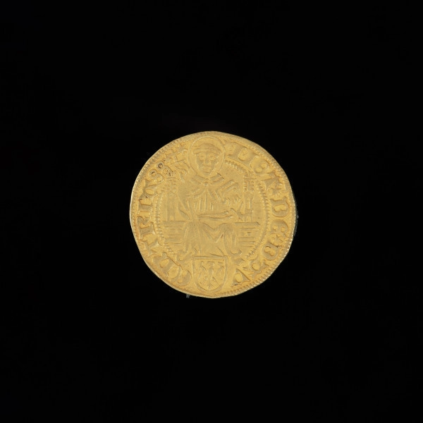 złoty gulden - Ujęcie rewersu. Moneta z jabłkiem cesarskim w bordiurze na awersie i wizerunkiem świętego Lebuina na rewersie. Na rewersie: siedzący św. Lebuin, napis w otoku: MOT - DE - DAV - ENTRIA88.