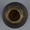 S/CS/1361/ML - Wazon cylindryczny, lekko rozszerzony ku dołowi, z wyodrębnioną niska stopą i rozchylonym wylewem. Korpus bezbarwny, podmalowany żółtym pudrem  - z wyjątkiem części środkowej. Powlekany warstwą fioletową i brązową; w nich trawiona i polerowana dekoracja roślinna: gałąź glicynii z kwiatami.
 