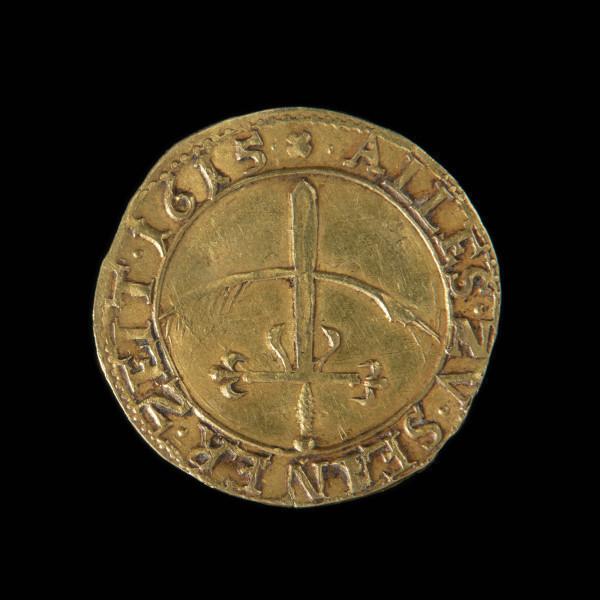 gulden okolicznościowy - Ujęcie rewersu. Na rewersie miecz skrzyżowany z piórem. Obsadka pióra z prawej strony. W otoku liniowo-perełkowym napis.