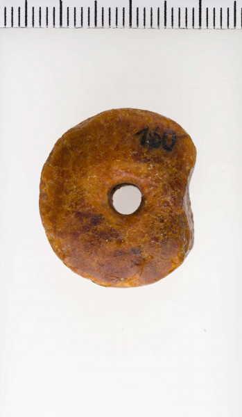 Paciorek typu VC, stożkowaty. Widoczne ślady toczenia.