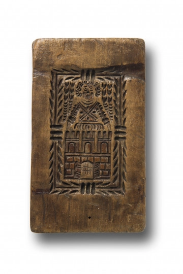 MT/P/124 Jedna ze stron formy z negatywowym rytem przedstawiającym herb Torunia, czyli mur z otwartą bramą miejską, trzema basztami oraz aniołem symbolizującym opiekę nad miastem. Całość w prostokątnym ozdobnym obramowaniu.