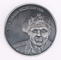 H/2449/MRK/ML - Medal bity w białym metalu, oksydowany. Na awersie popiersie gen. Maczka w berecie, na rewersie w środku symboliczne budowle, odznaka dywizyjna i napis `Dziękujemy Wam Polacy` w otoku daty 1944-2004 29 Oktober.
